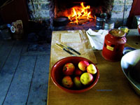 baking an apple pie in front of the fireplace