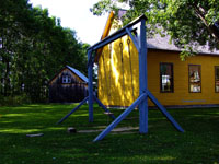 heritage schoolhouse with outside swings