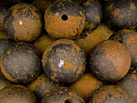 pile of rusted cannonballs